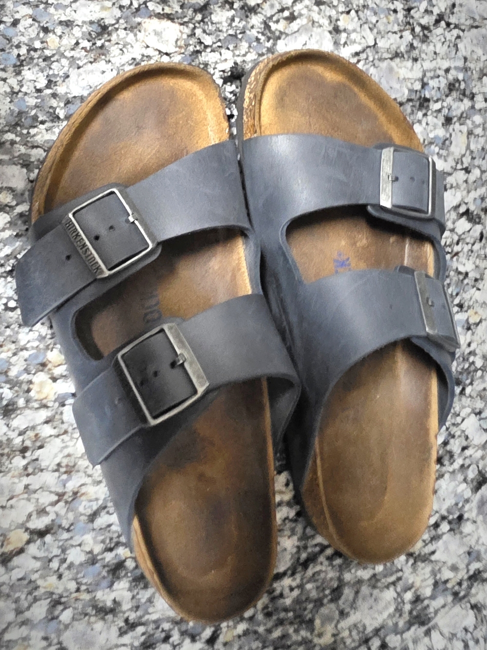 Birkenstock Men’s Arizona Two-Strap Sandals in Black with Brown Footbed